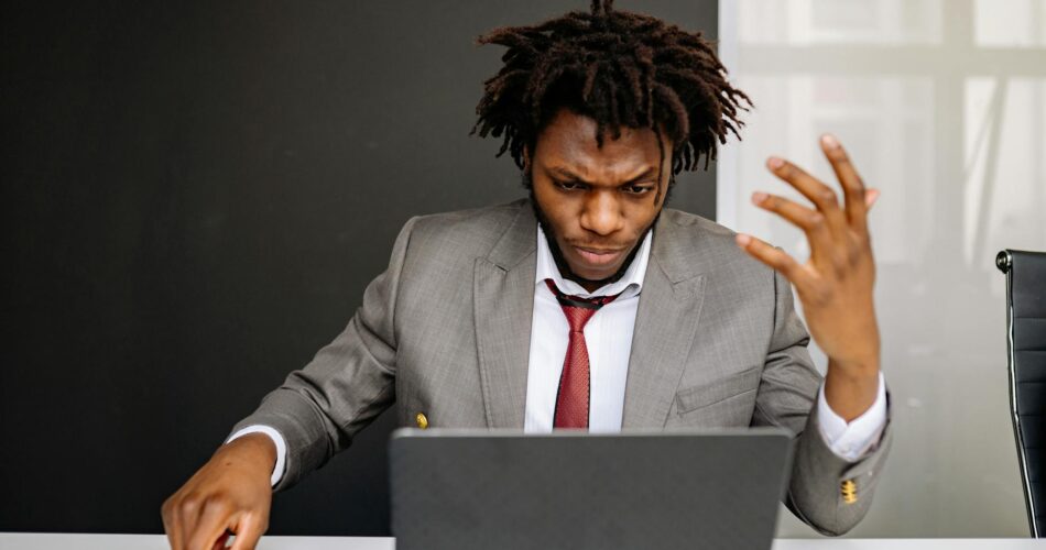 a businessman with a serious facial expression while working