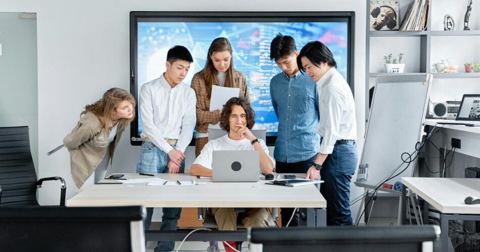 people looking at the laptop screen