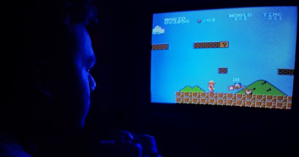 photo of man playing super mario bros