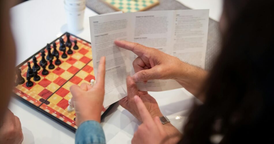 reading the instructions for playing chess