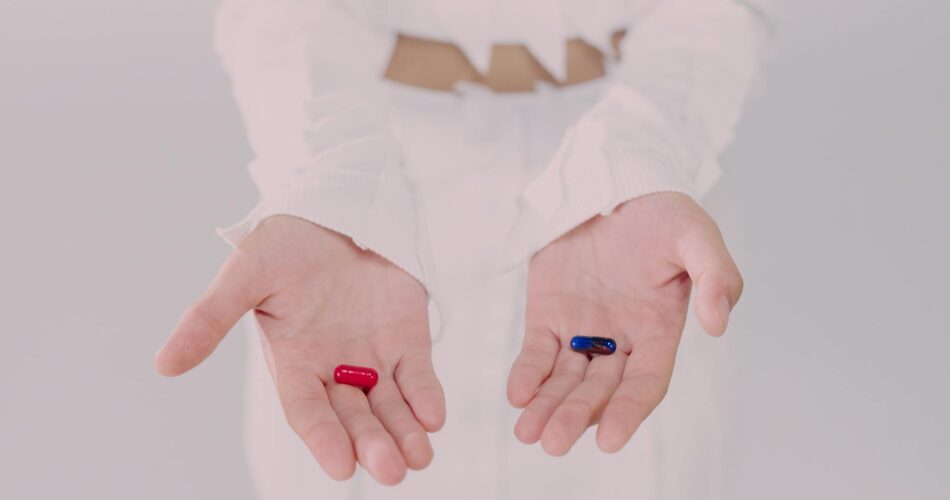 woman holding pills